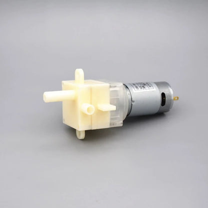Bomba de agua autocebante de CC miniatura GDB-390T: compacta y versátil para un funcionamiento eficiente.